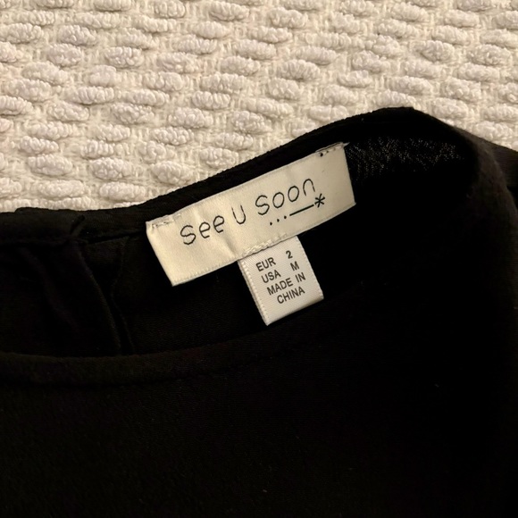 Lightweight Loose Black Top with Ruffle Bottom & Buttons on Back - Picture 3 of 3